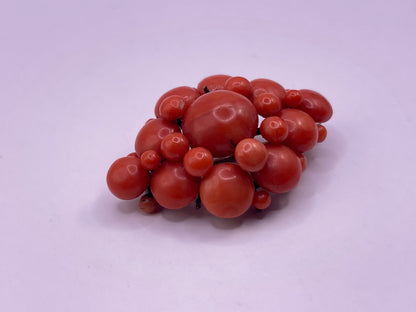 A natural untreated coral orange/ pink pin/ pendant