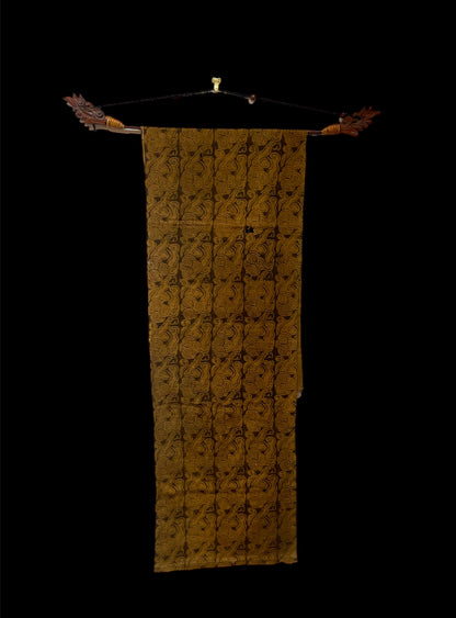 An antique woven and dyed fabric with block print pattern