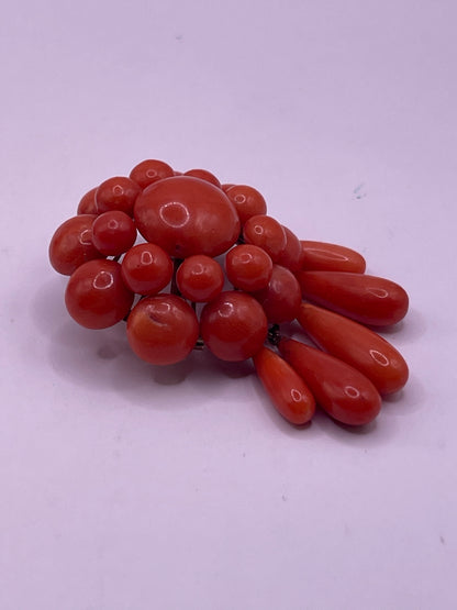A natural untreated coral orange/ pink pin/ pendant