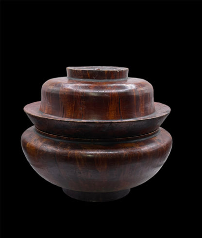 An antique burlwood tsampa container with lid