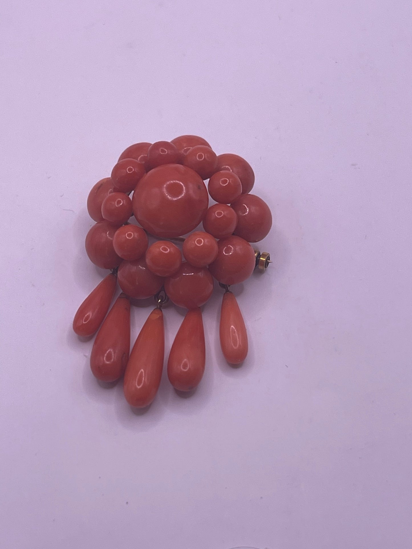 A natural untreated coral orange/ pink pin/ pendant