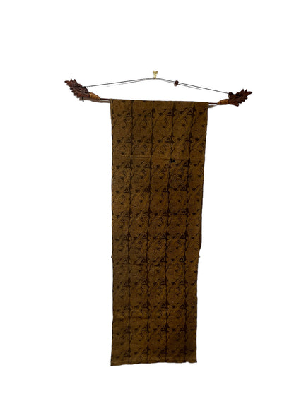 An antique woven and dyed fabric with block print pattern