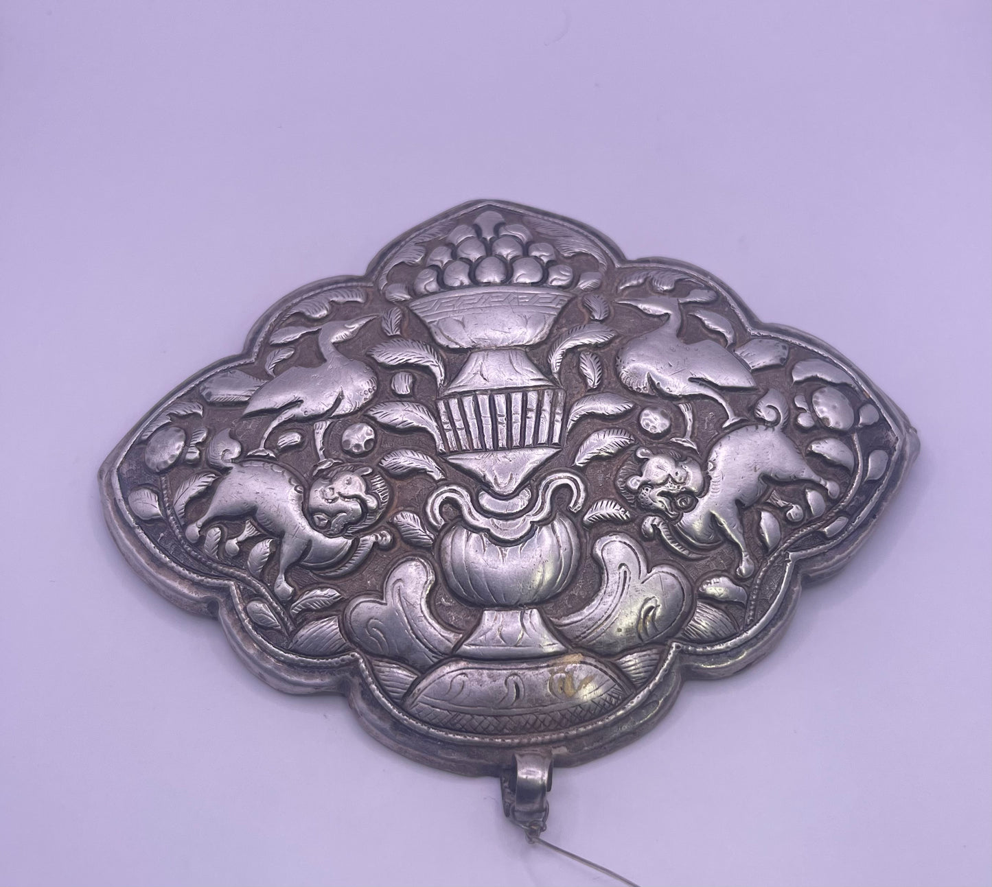 An antique Tibetan silver belt buckle