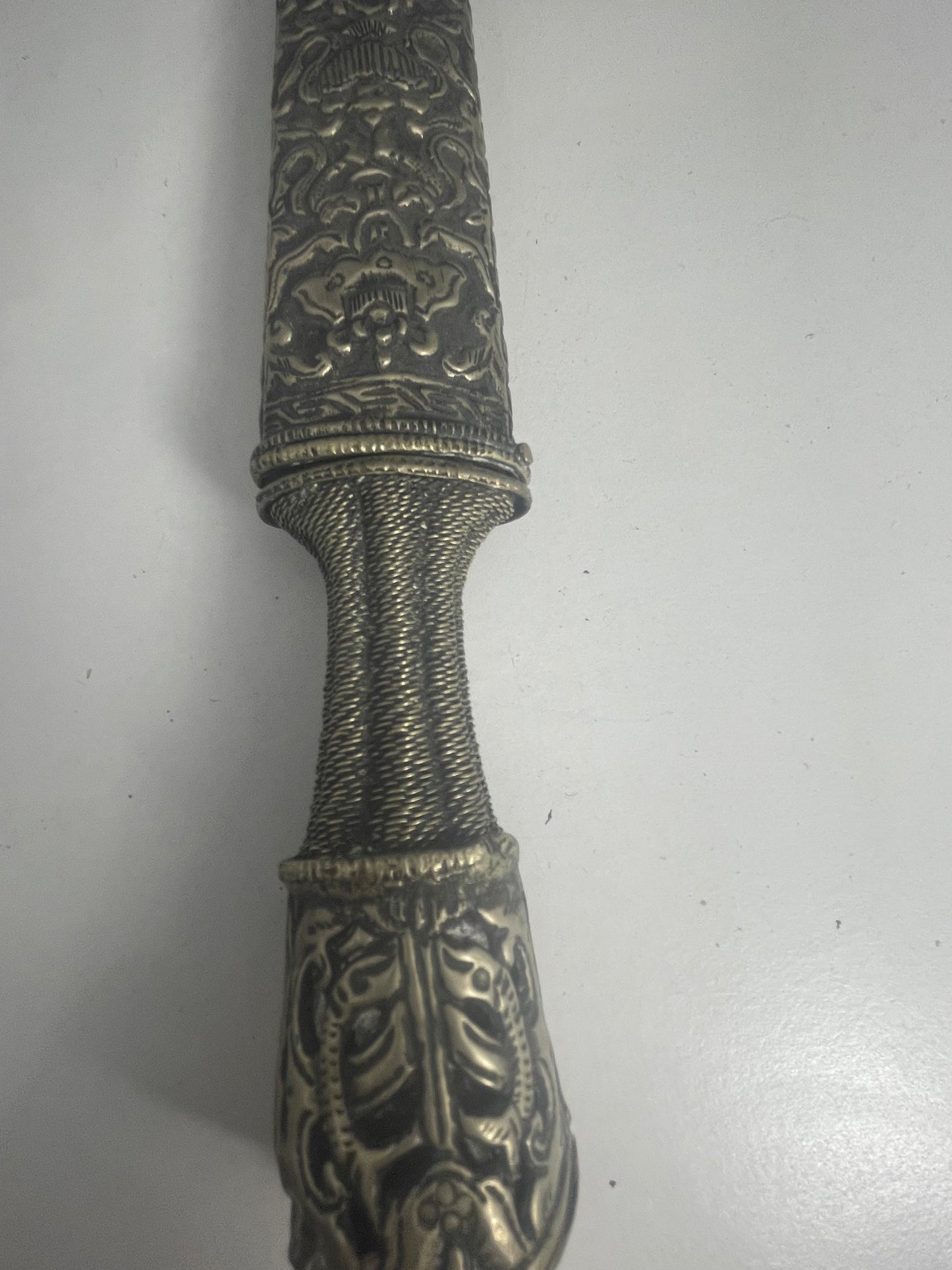 A vintage Tibetan dagger with a carved sheath