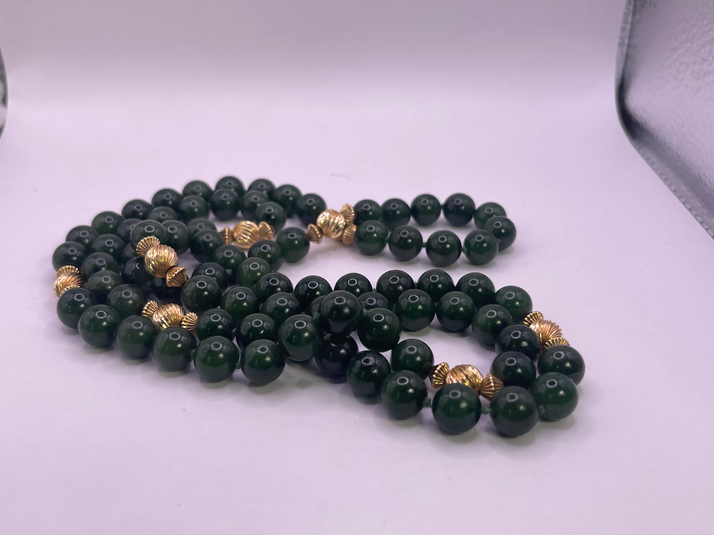 A jade nephrite and gold bead necklace