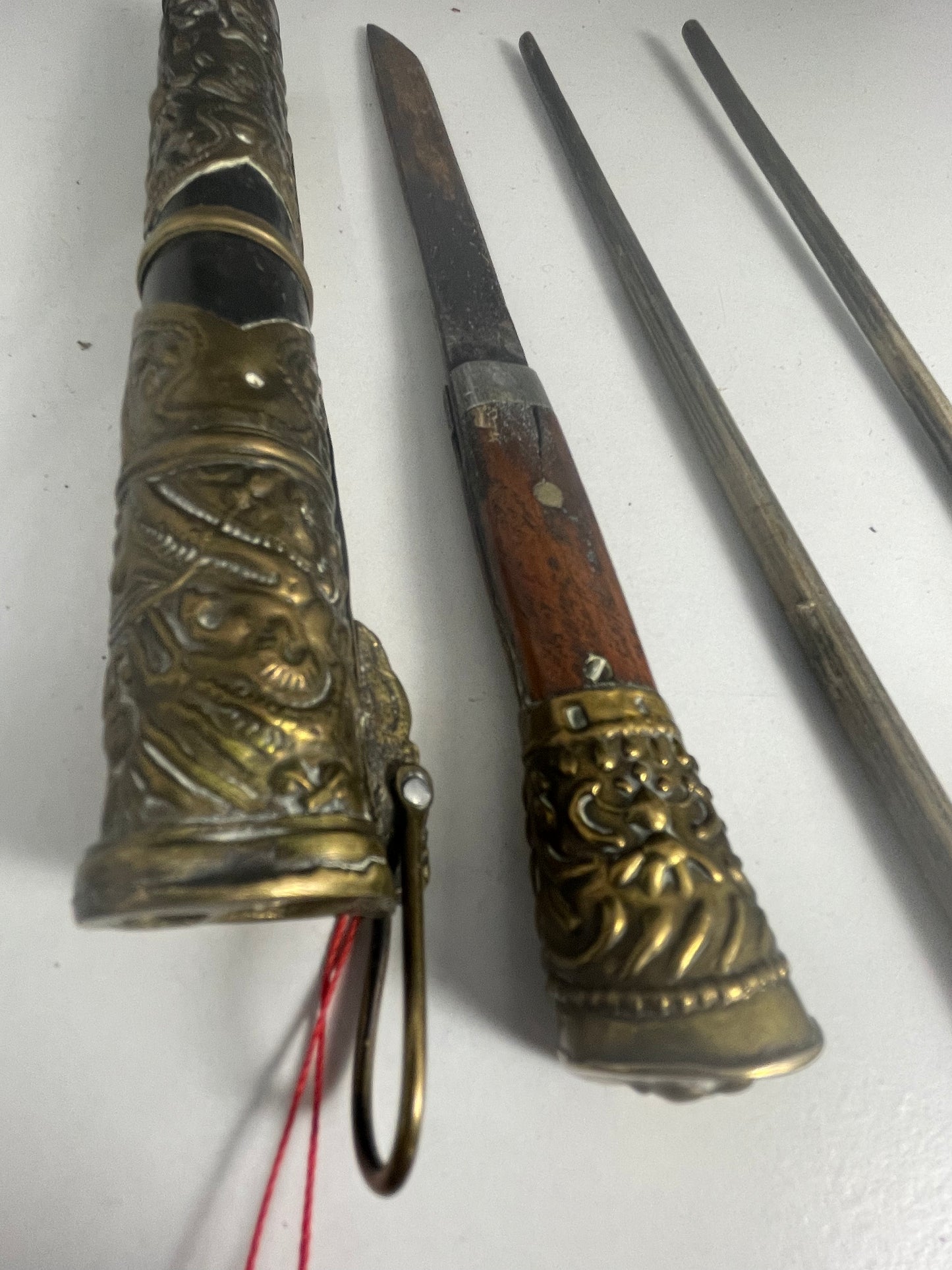 A vintage traveling dagger and chopsticks set