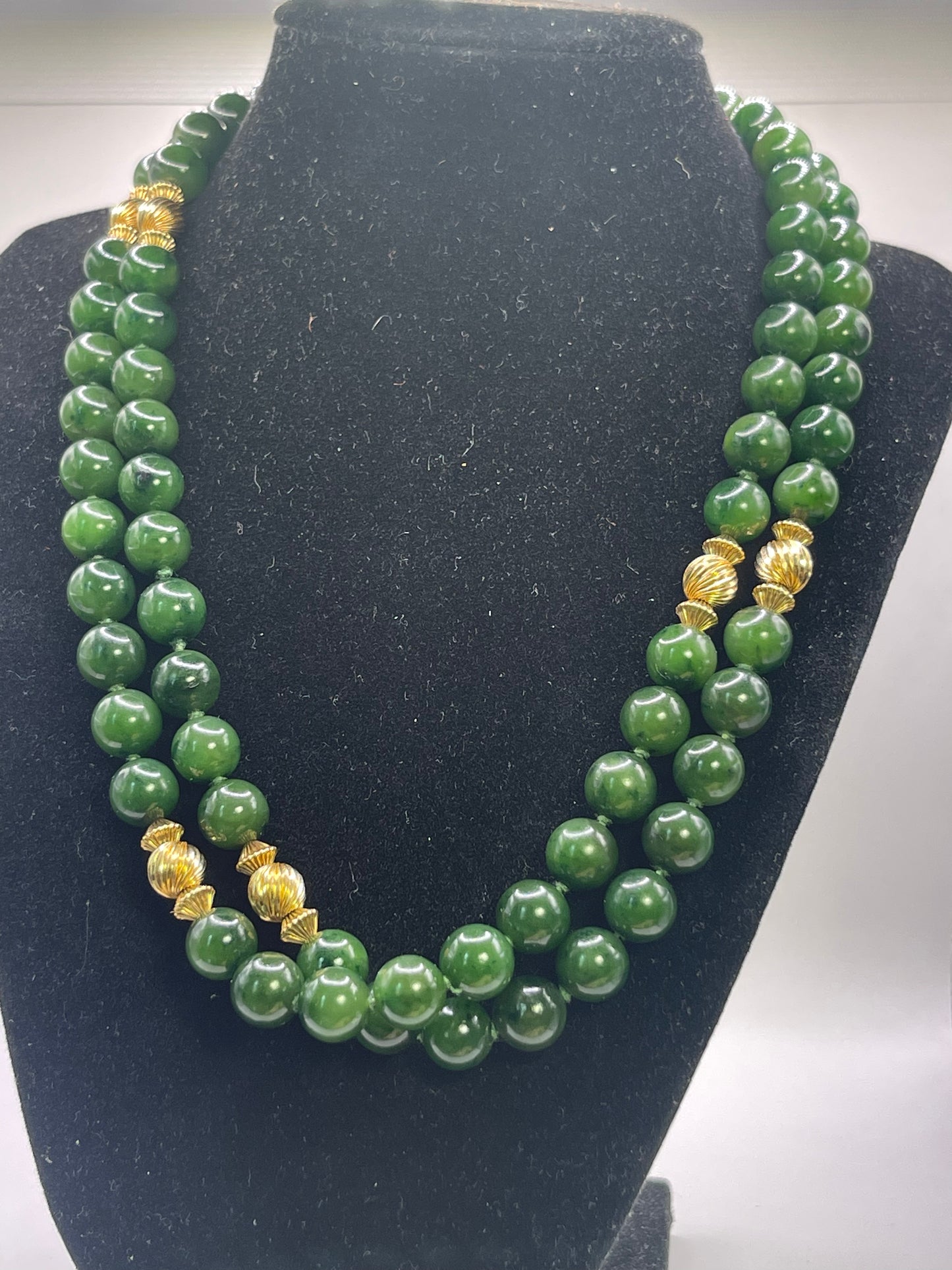 A jade nephrite and gold bead necklace