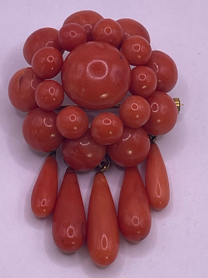 A natural untreated coral orange/ pink pin/ pendant