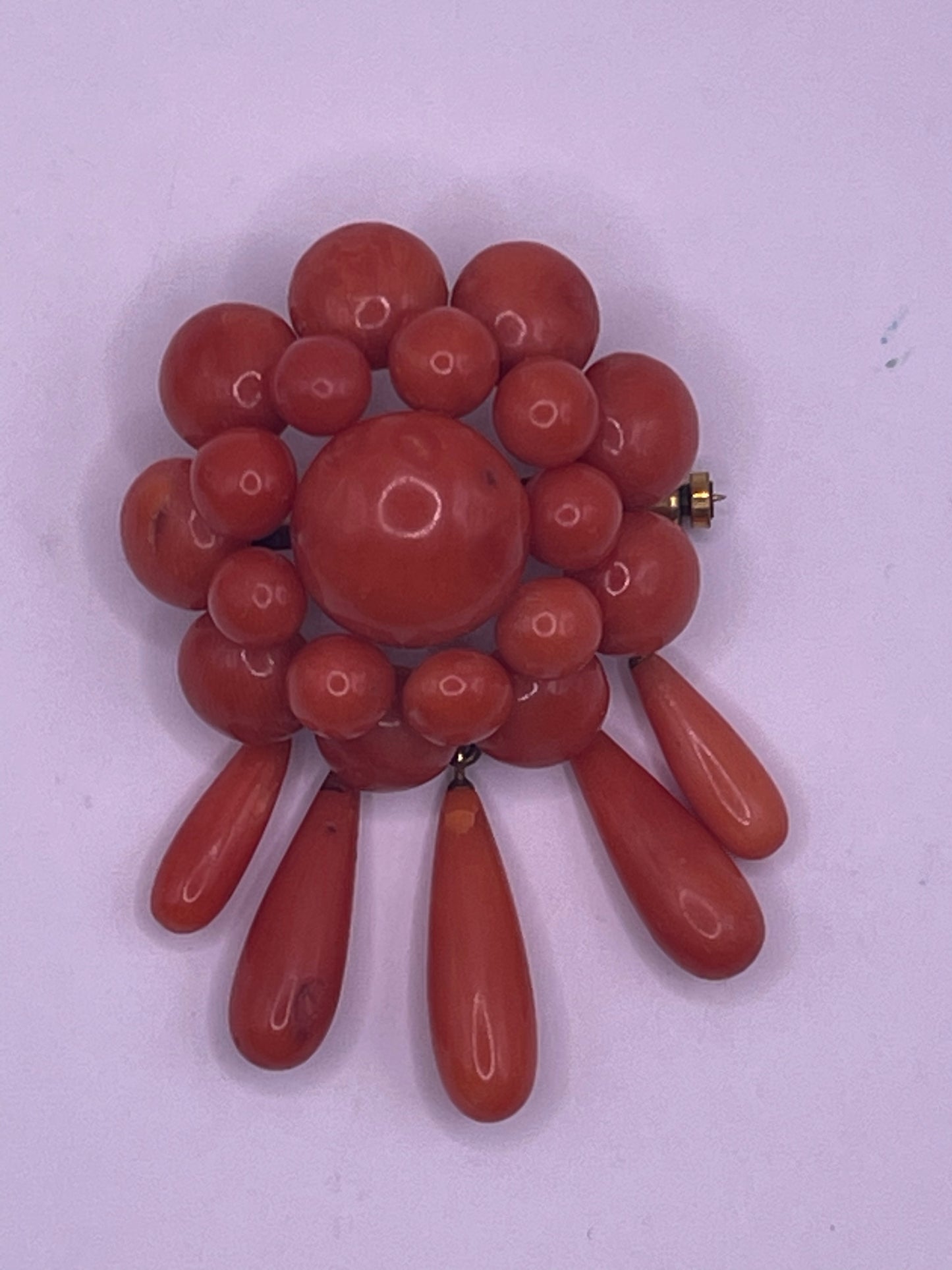 A natural untreated coral orange/ pink pin/ pendant