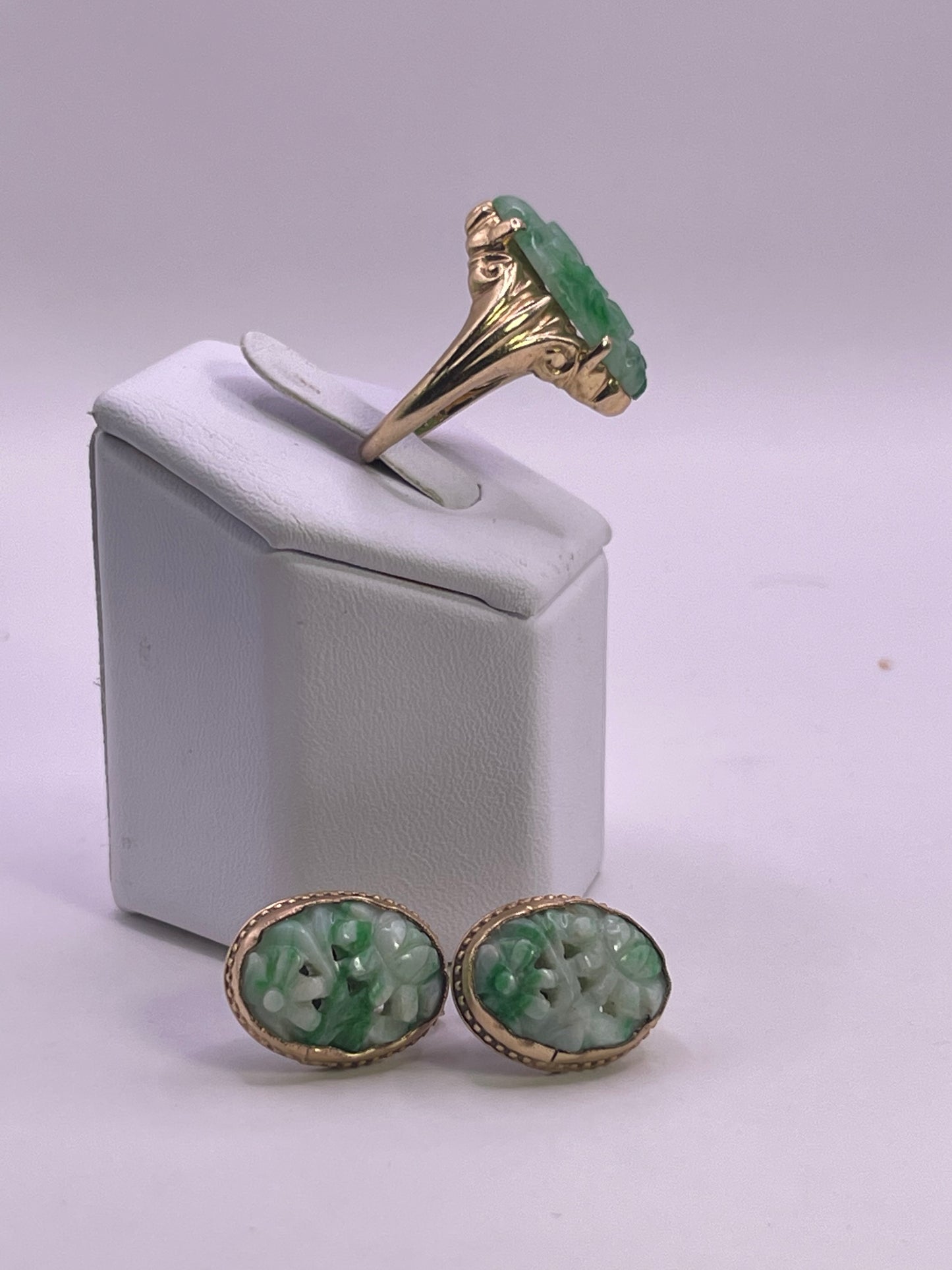 A jade jewelry set is 14kt gold setting