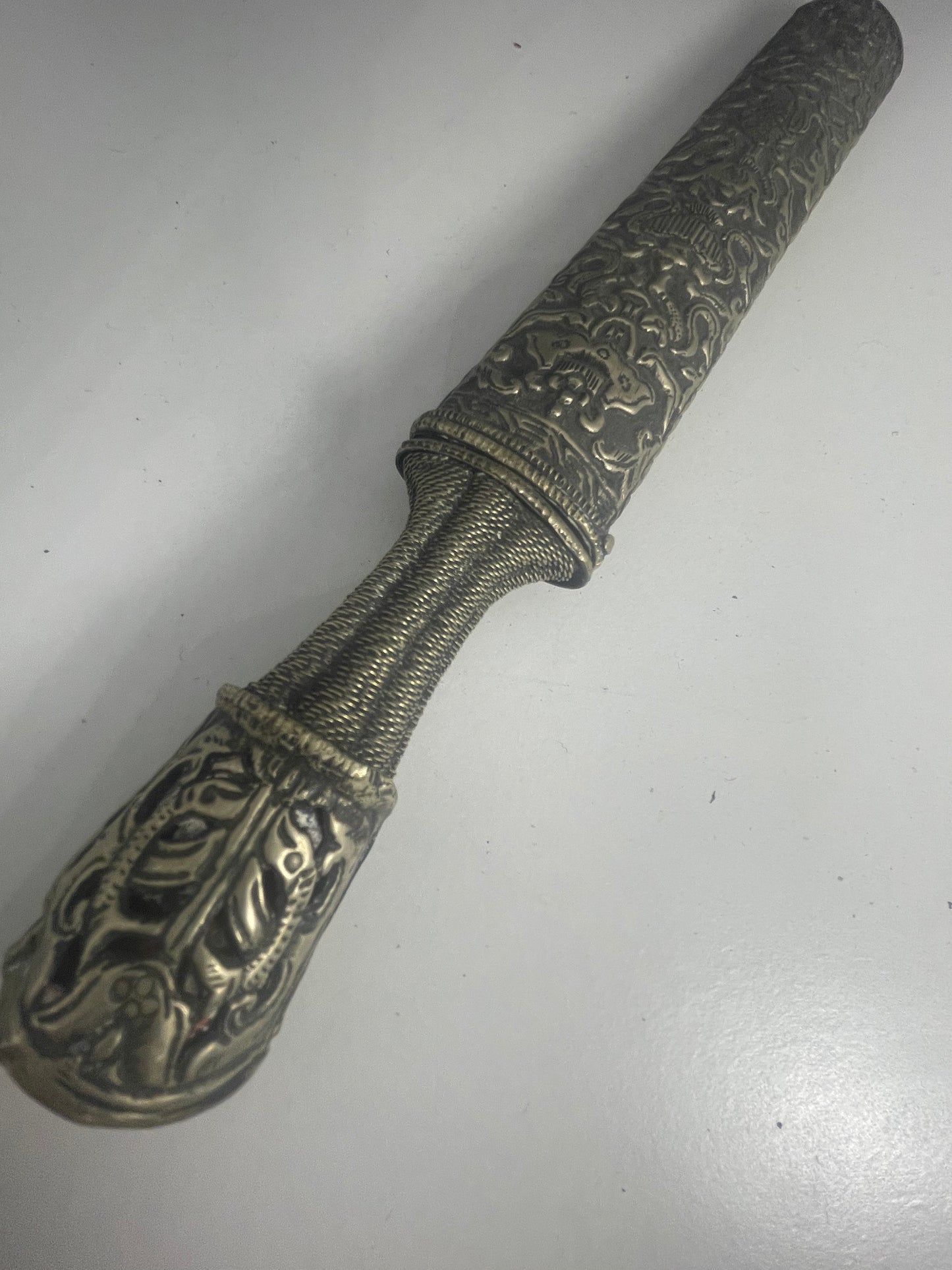 A vintage Tibetan dagger with a carved sheath