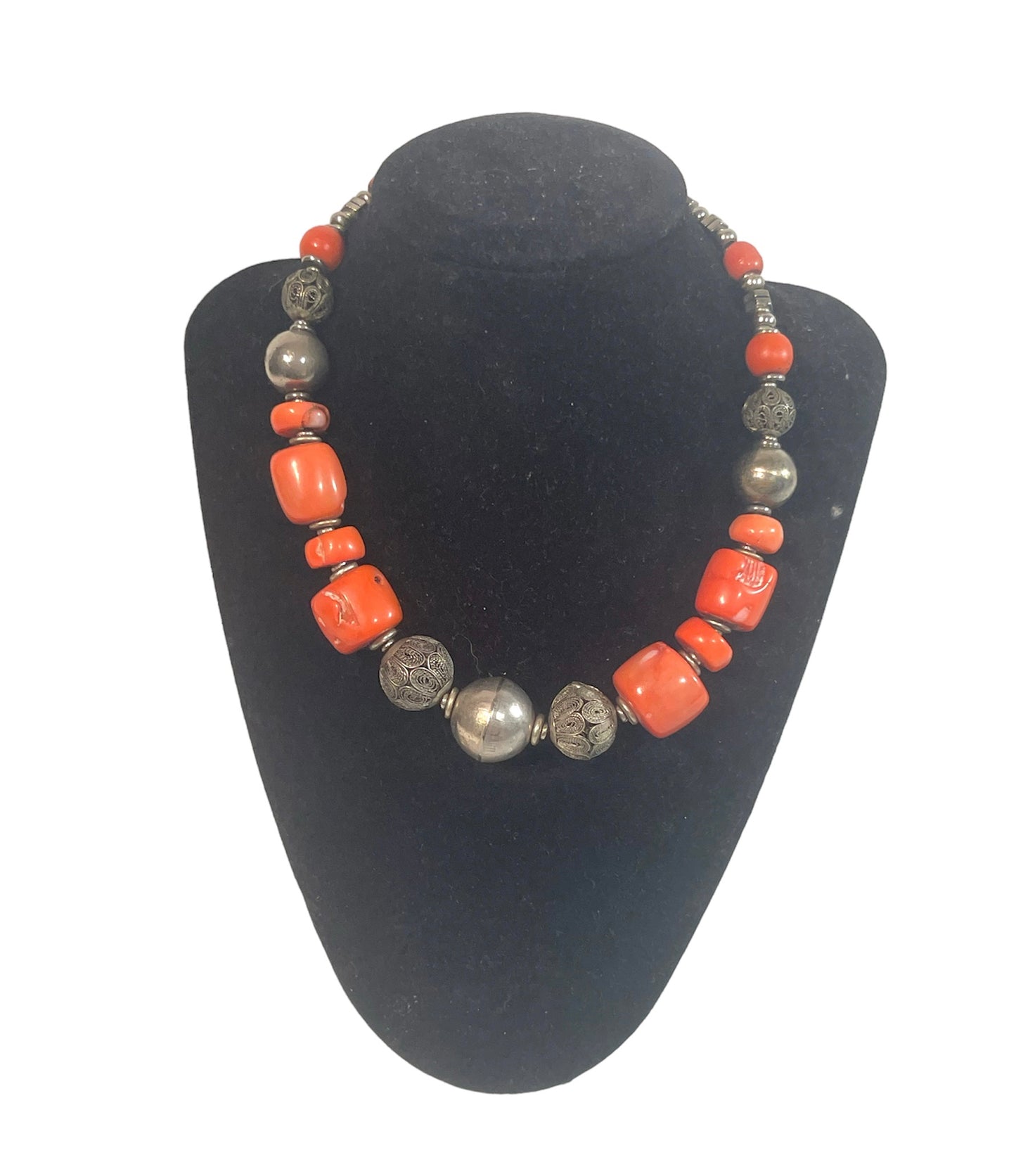 A coral and silver necklace