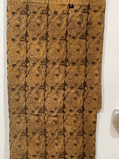 An antique woven and dyed fabric with block print pattern