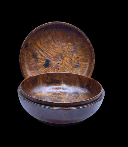 An antique burlwood tsampa bowl with cover
