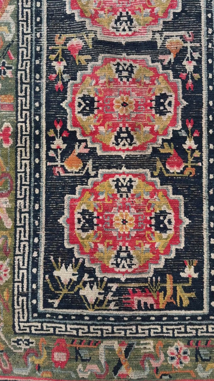 An antique Tibetan residential  rug with medallions