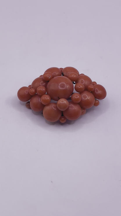 A natural untreated coral orange/ pink pin/ pendant