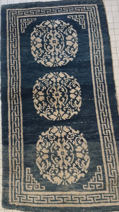 An antique Tibetan residential  rug with medallions