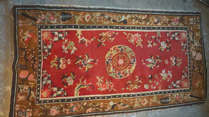 An antique Tibetan wool rug