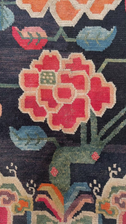 An early 20th C., antique Tibetan floral  rug