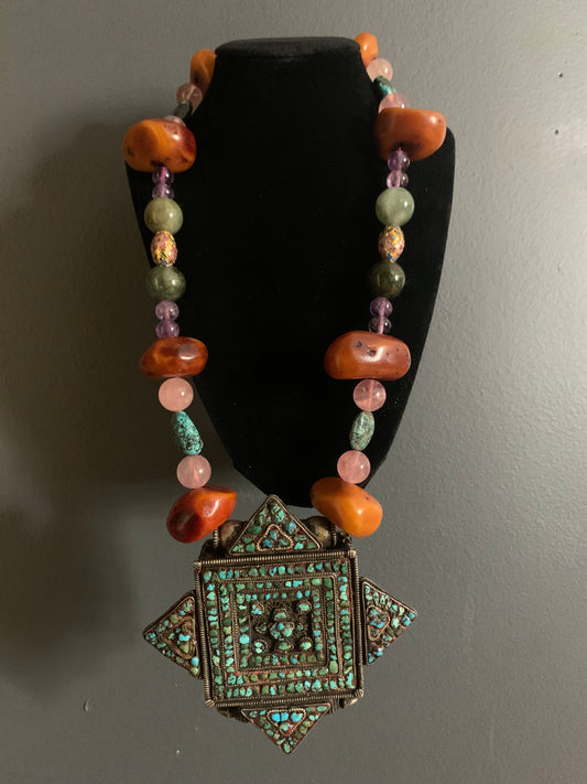 A vintage Tibetan ghau necklace