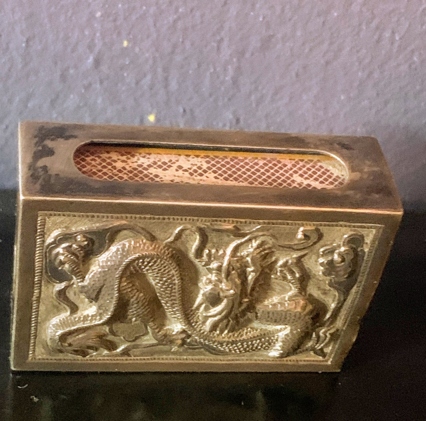 A silver matchbox cover
