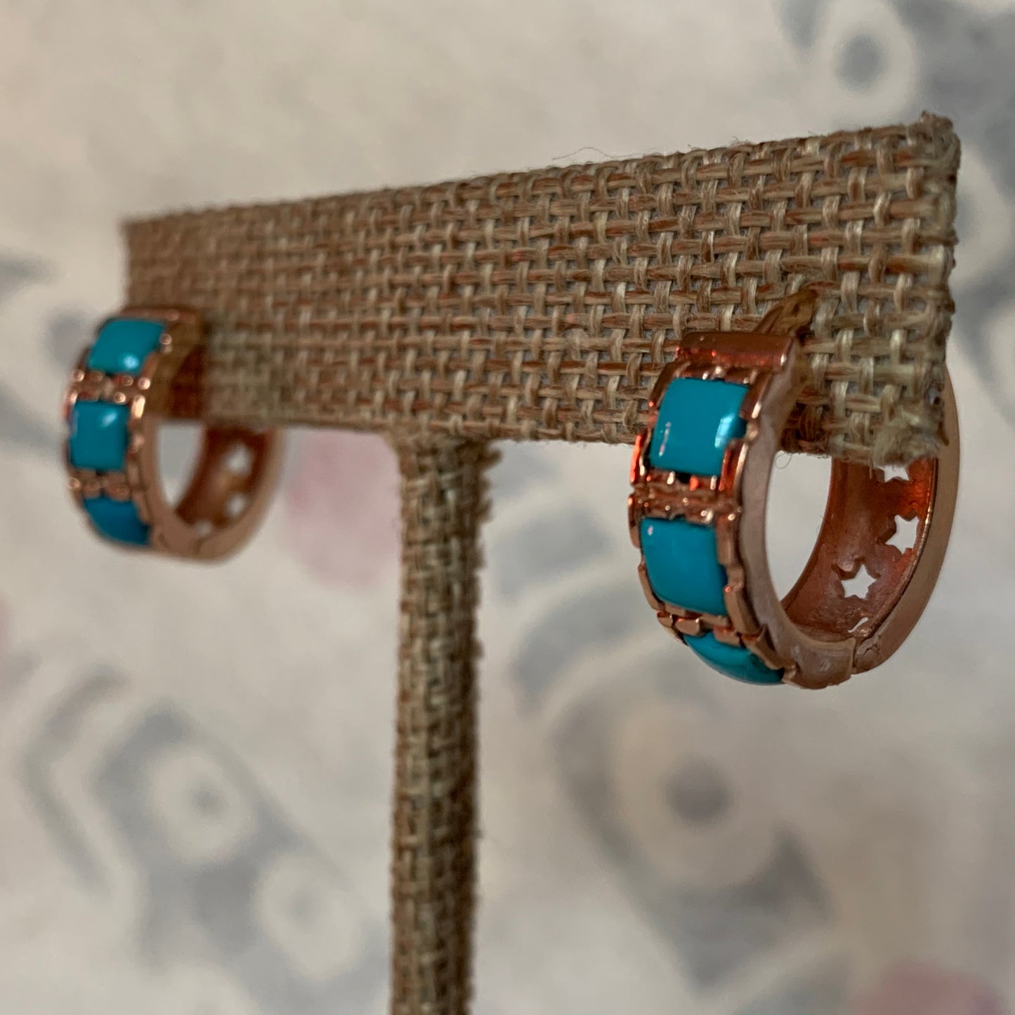 A pair of turquoise hoop earrings