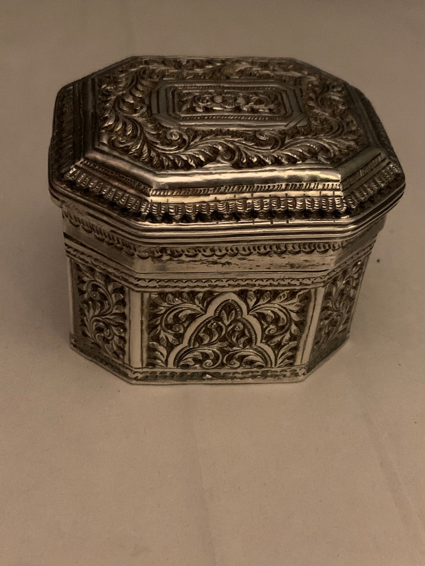 An octagonal silver box