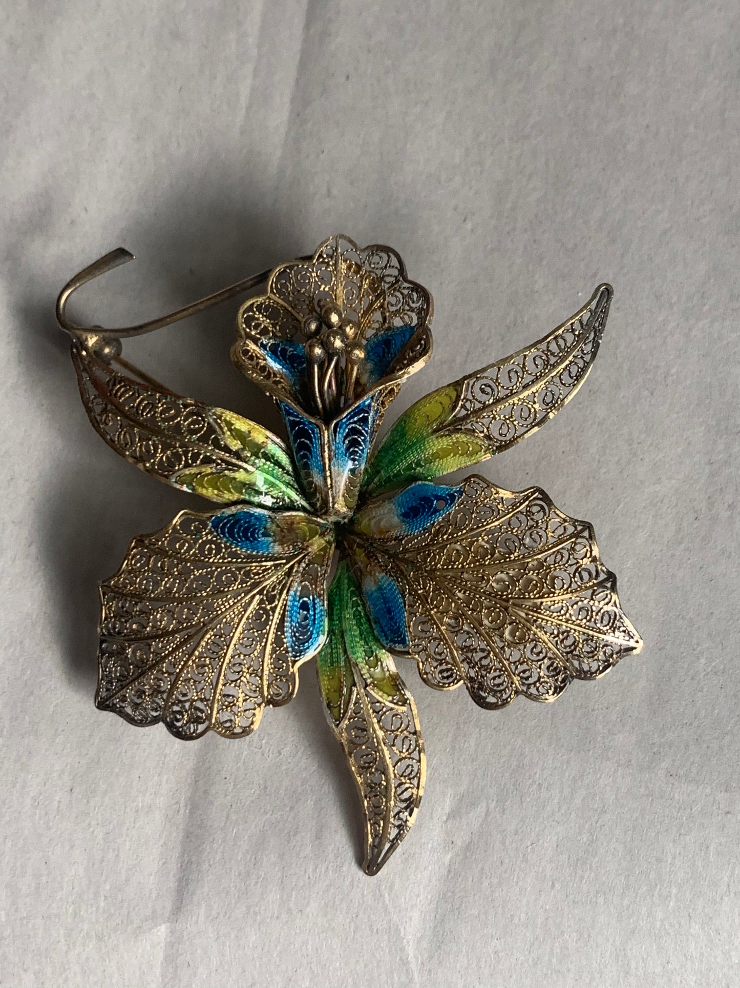 A filigree/ enamel Florence-orchid brooch