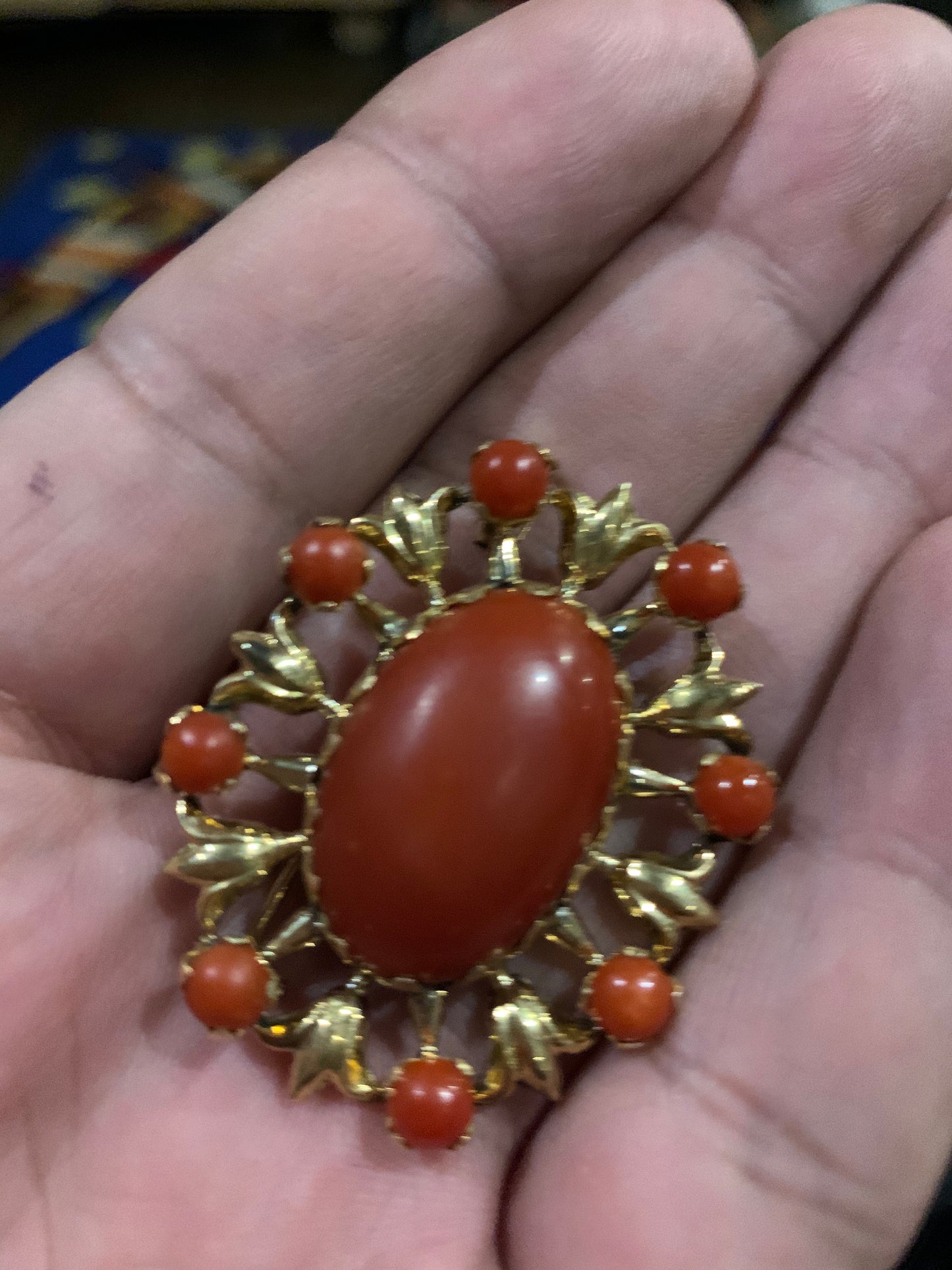 A vintage red coral brooch in 18kt setting