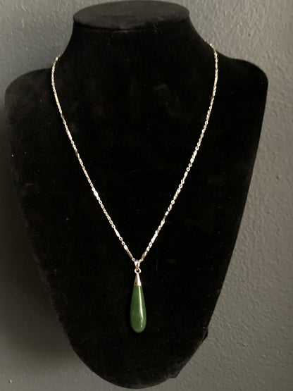 A jade tear drop ear ring and necklace in silver