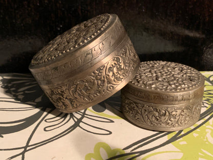 Two metal pill boxes