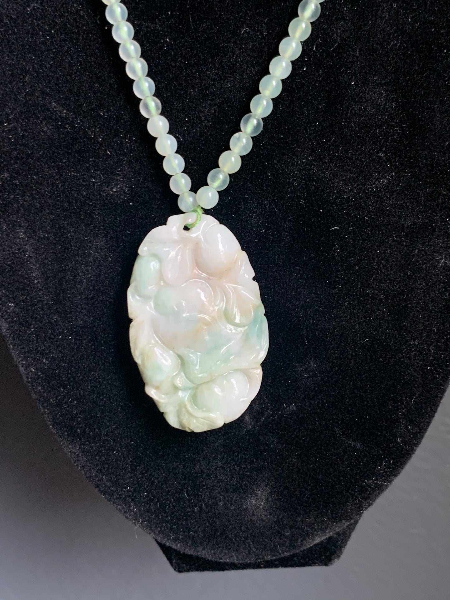 A jade necklace and pendant