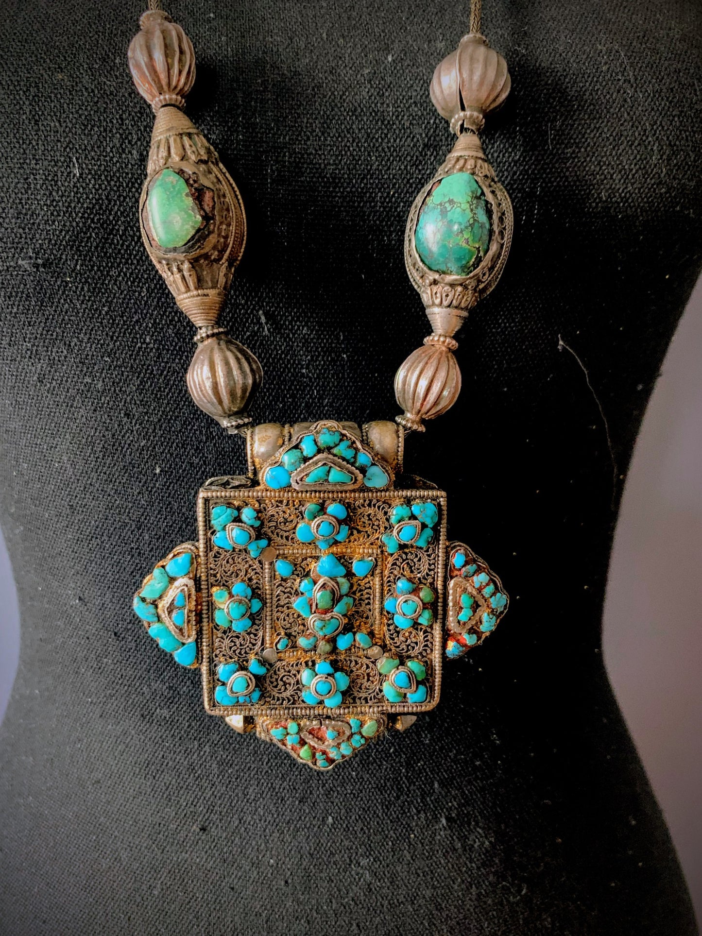 Tibetan Turquoise and silver ghau on a silver chain