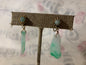A pair of jade and gold ear rings