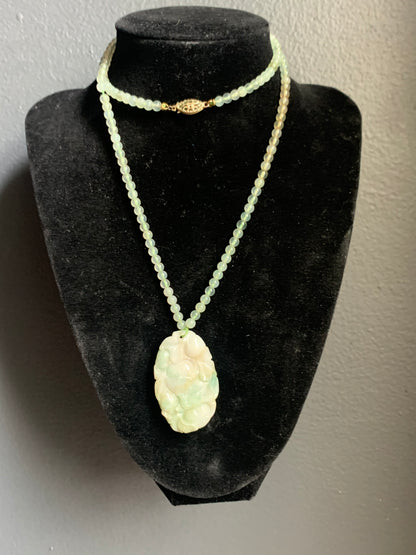 A jade necklace and pendant