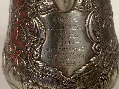 A silver creamer (roses)
