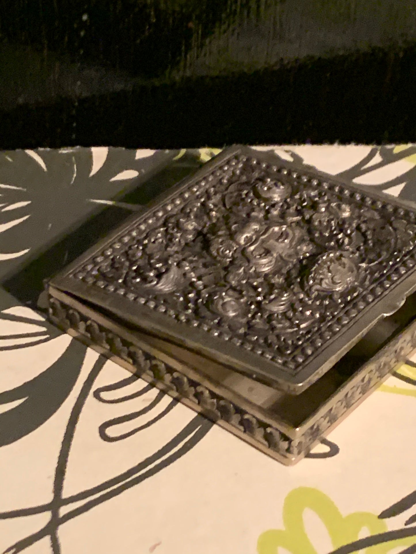 A silver compact box
