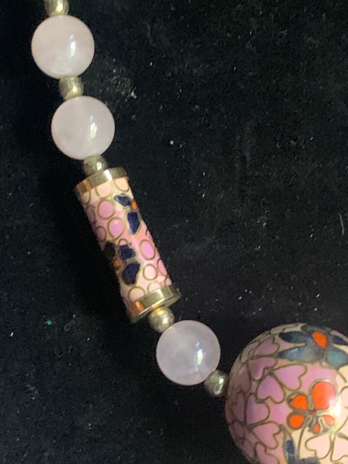 A necklace with rose quartz beads