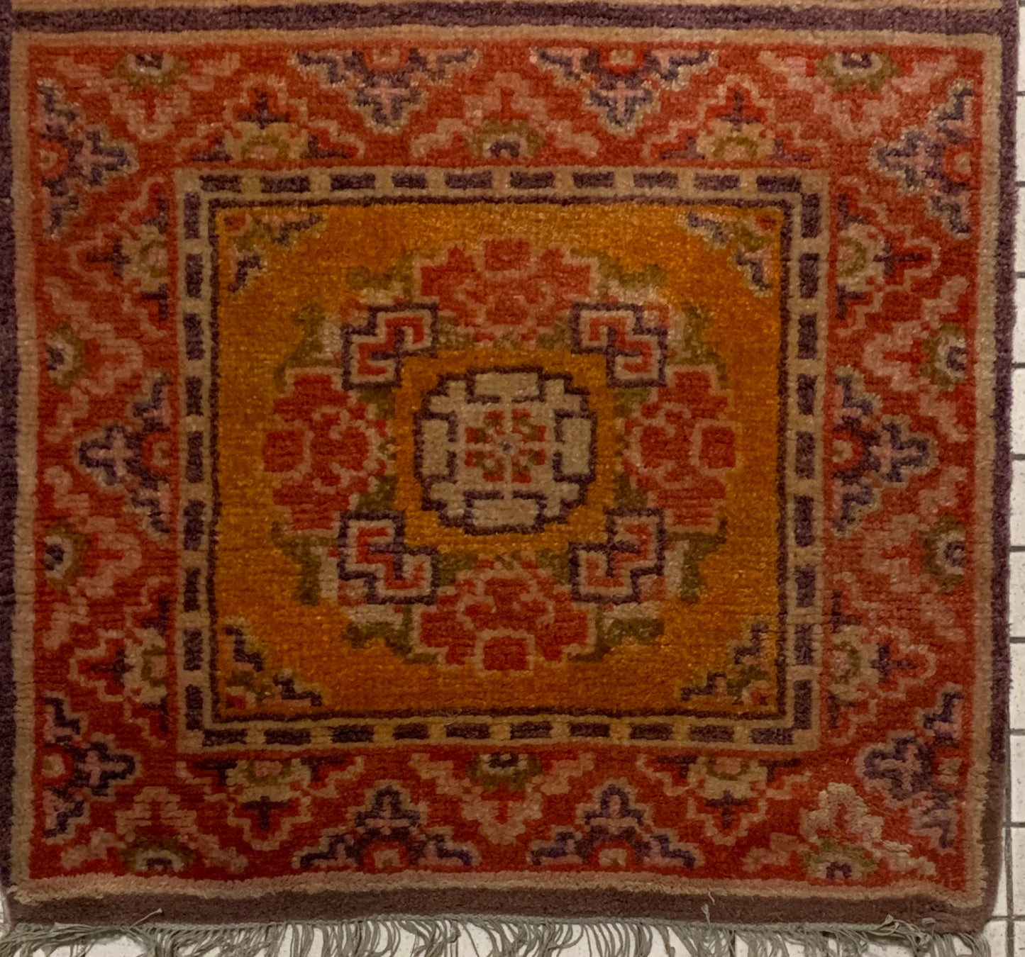 An antique triple seater Tibetan meditation rug