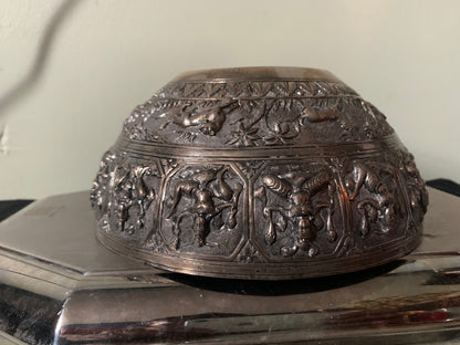 A silver repousse bowl