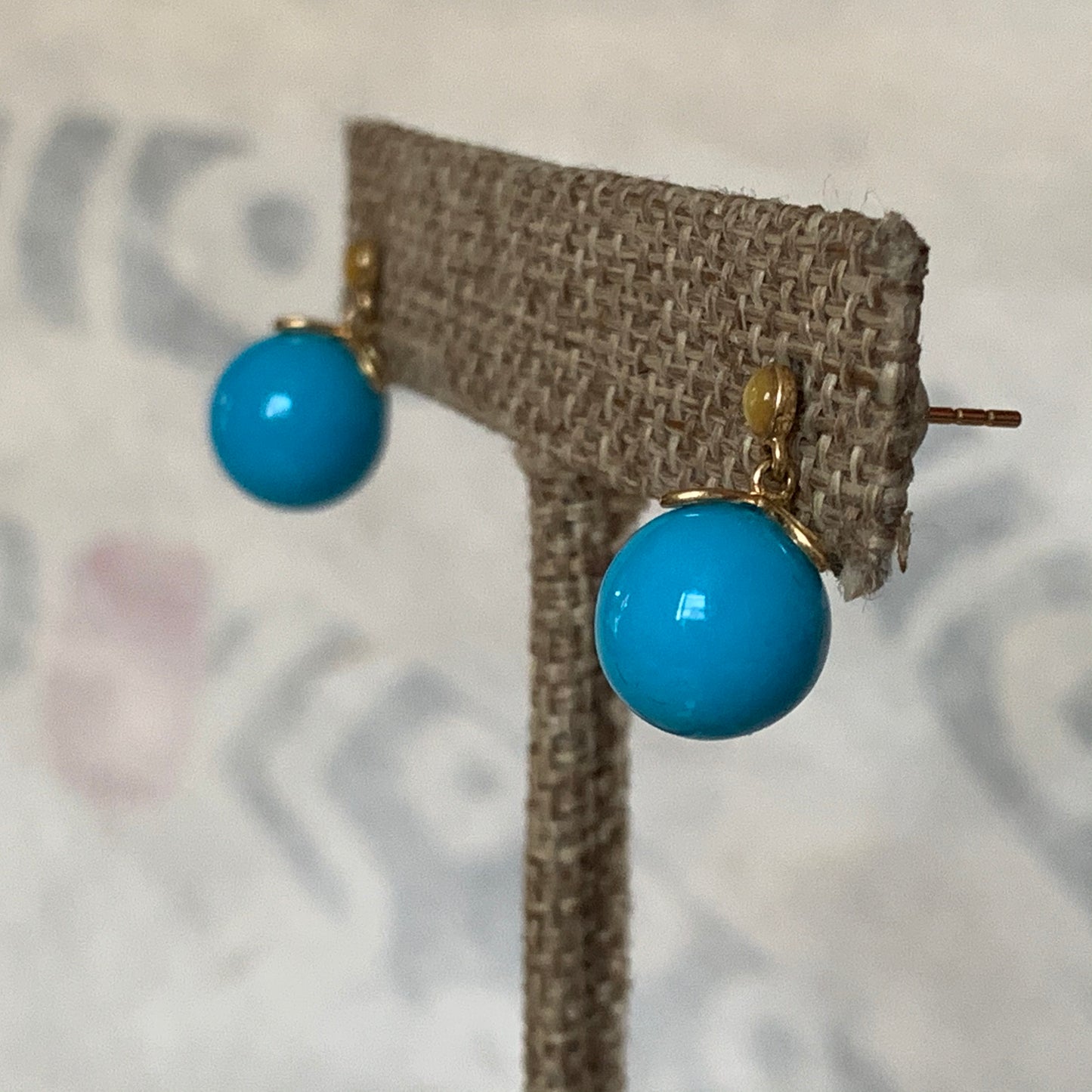 A pair of turquoise earrings