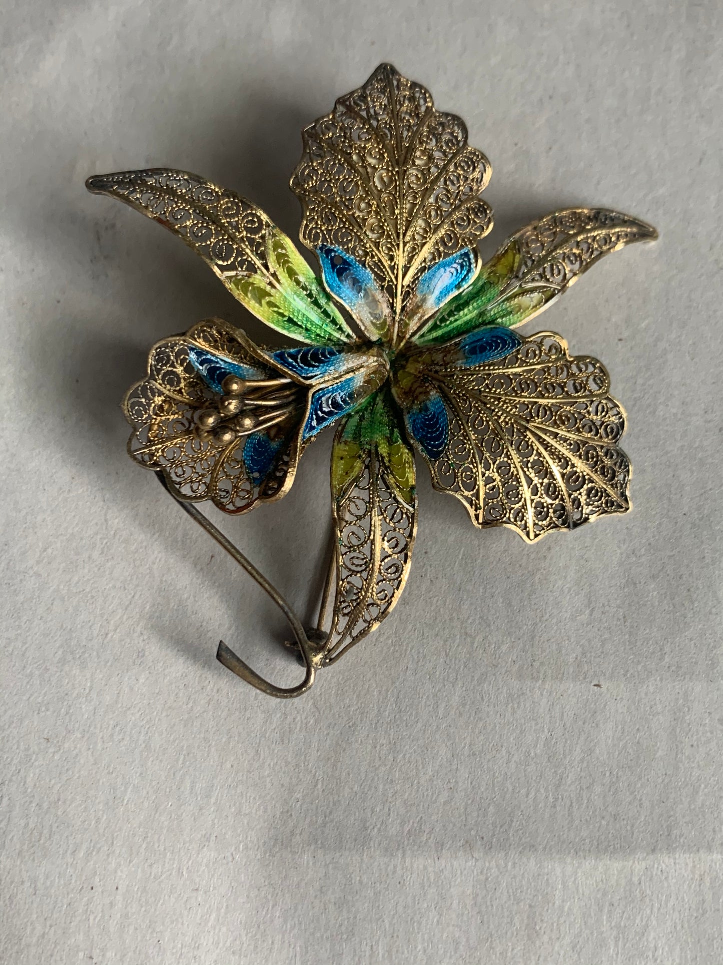 A filigree/ enamel Florence-orchid brooch