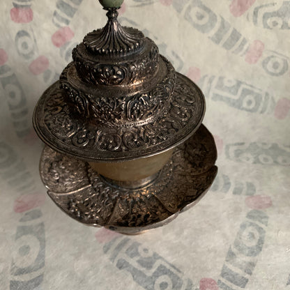 A silver Tibetan cup stand