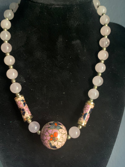 A necklace with rose quartz beads