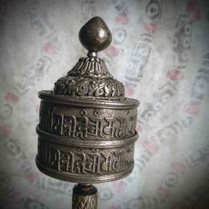 An antique Tibetan handheld prayer wheel