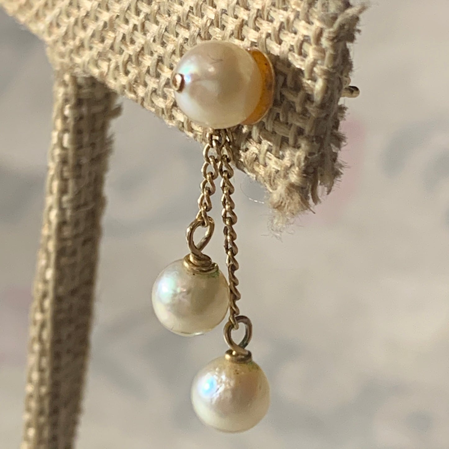 A pair of pearl and gold earrings