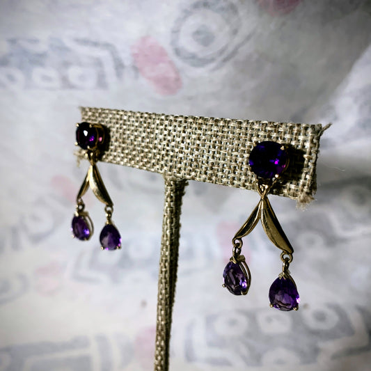 A pair of amethyst gold earrings