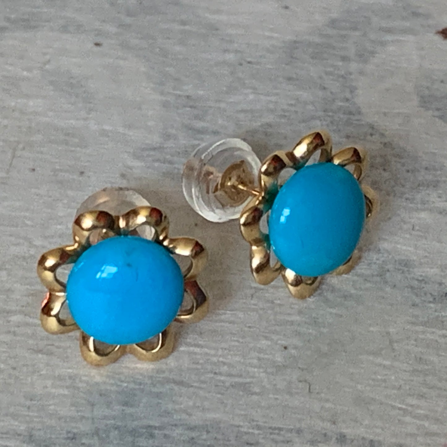 A pair of turquoise earrings in 14kt setting