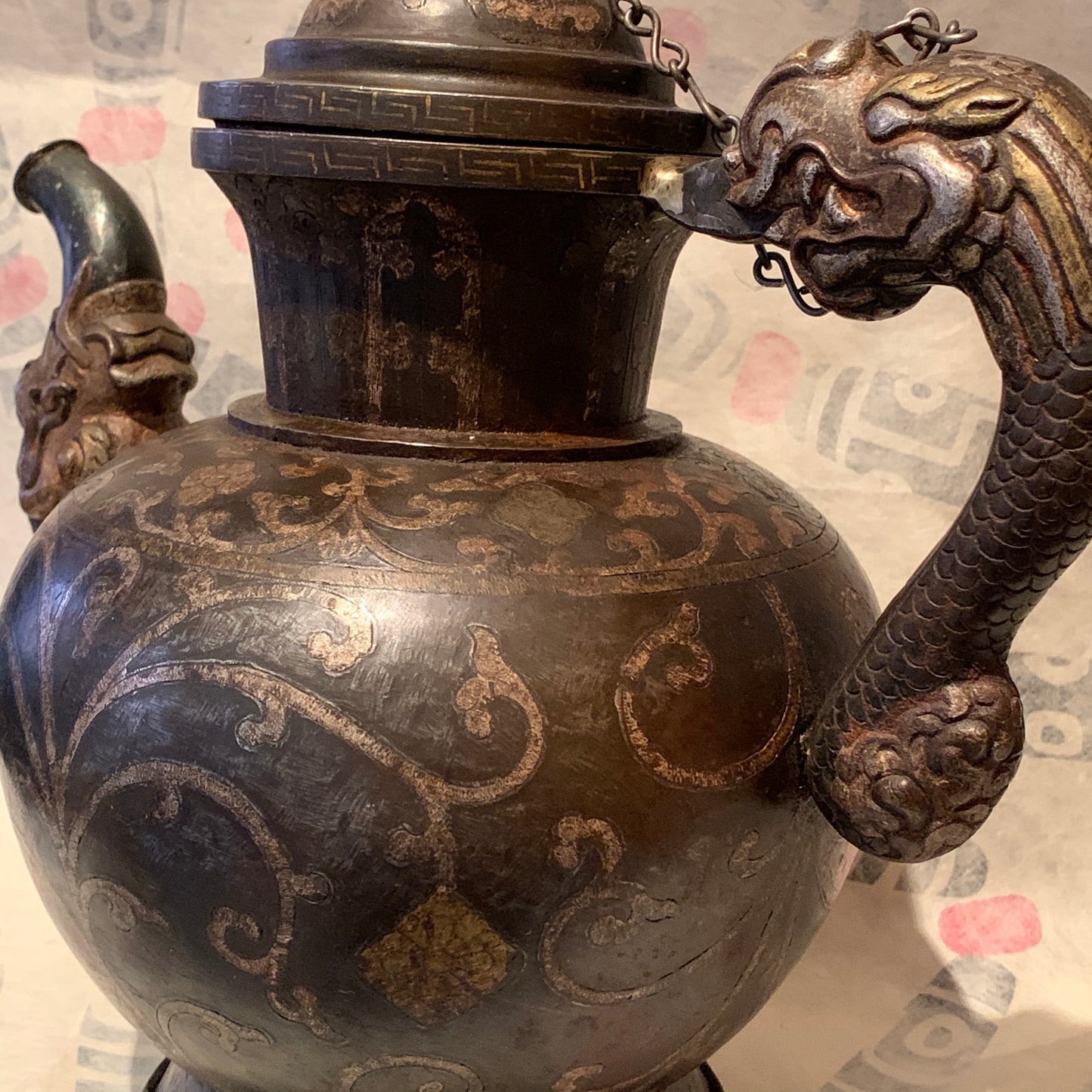 An antique Tibetan iron and silver teapot