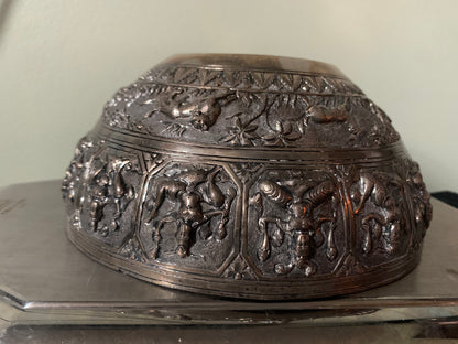 A silver repousse bowl